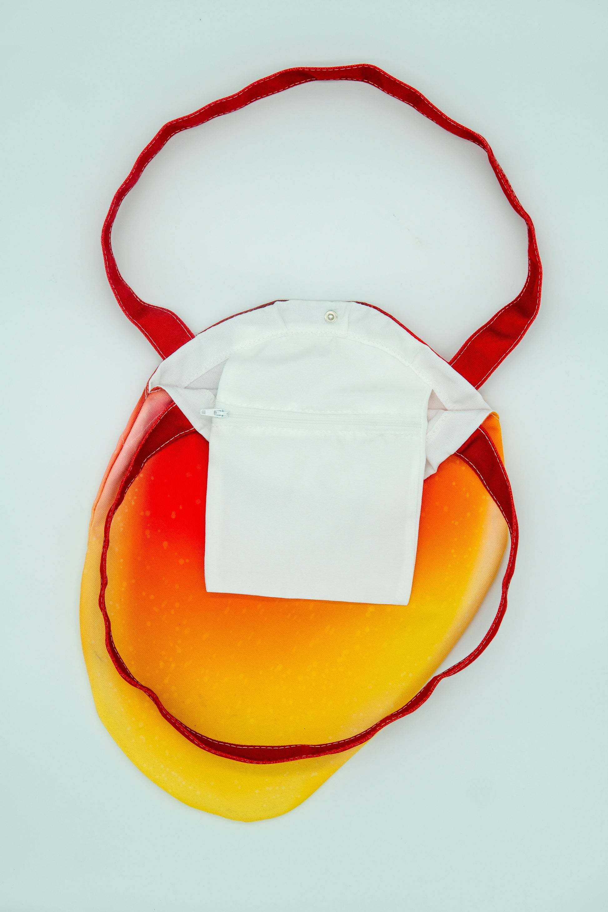 Red and yellow mango shaped tote bag, showing inside pocket